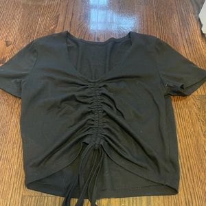 Black top with drawstring in the middle